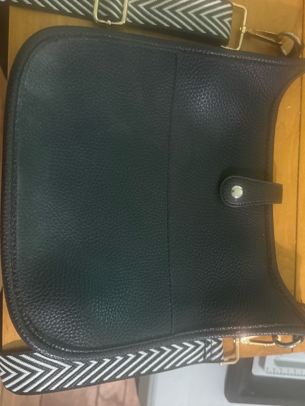 Black Leather Crossbody Bag with Patterned Strap